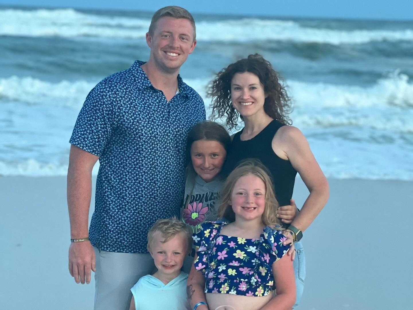 Phillip Norman with his wife and children at the beach